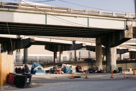 tents under a concrete overpass