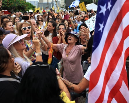 Israelis celebrate as they react to the news of the Gaza peace deal