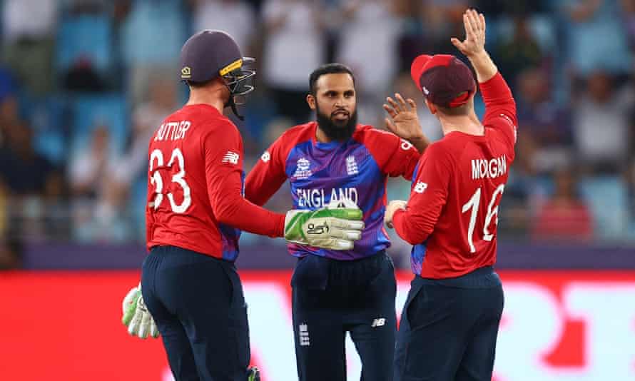 Adil Rashid celebrates the wicket of Marcus Stoinis on Saturday with Jos Buttler and Eoin Morgan. England will secure a semi-final place if they beat Sri Lanka on Monday.