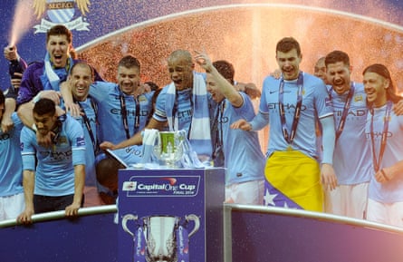 Manchester City celebrate with the League Cup trophy after beating Sunderland