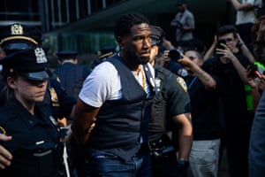 police escort a handcuffed man