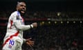Alexandre Lacazette punches the air in celebration