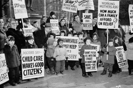 people hold signs in support of childcare programs