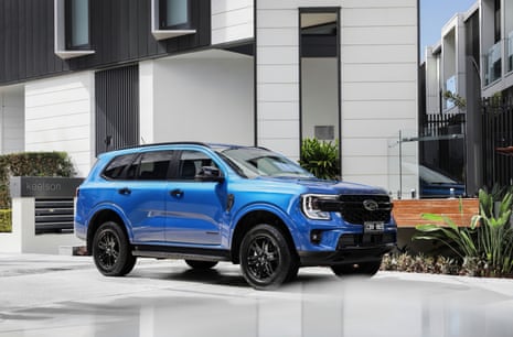 A Ford Everest parked outside an apartment building