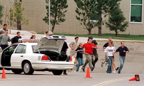 Students flee the 1999 shooting at Columbine high school, where 12 students and one teacher were murdered. 