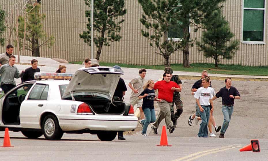 Students flee the 1999 shooting at Columbine high school, where 12 students and one teacher were murdered. 