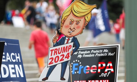 A Trump 2024 sign seen at a vendor's table during an anti-vaccine, anti-mask mandate rally in Harrisburg, Pennsylvania, last month.