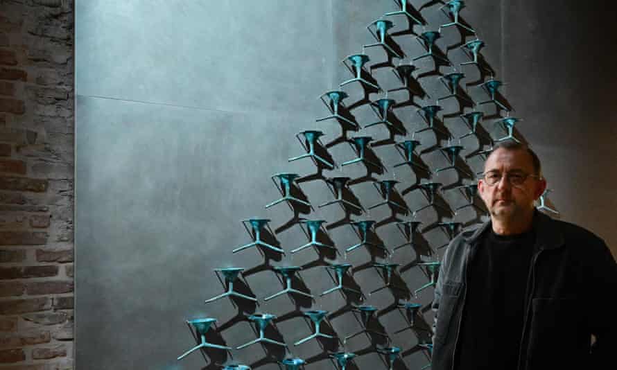 Ukrainian artist Pavlo Makov poses by his piece ‘Fountain of Exhaustion’ at Ukraine’s pavilion during a press day at the 59th Venice Art Biennale in Venice