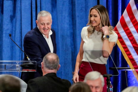 Newly-elected Chairman Michael Whatley, left, and Co-Chair Lara Trump, right, greet attendees as they crowd the podium after the general session of the Republican National Committee Spring Meeting Friday, March 8, 2024, in Houston.