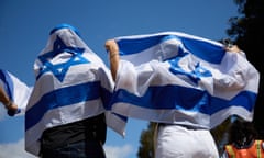 Supporters of Israel wave the country’s flag