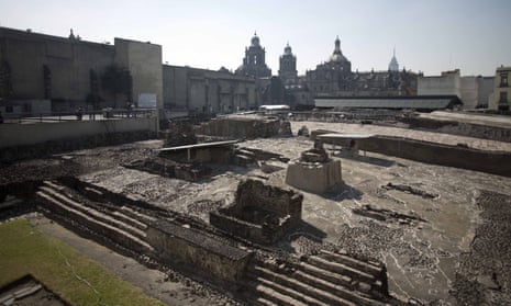 Tourists visit the Templo Mayor an Aztec archaeological site in Mexico City.