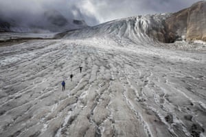 Ulrichen, Switzerland. Glaciologist Matthias Huss and his team at Gries glacier as a new report shows three cubic kilometres of ice - three thousand billion litres of water - evaporated from Swiss glaciers in 2022 because of weather conditions