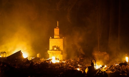 A structure on fire along the Big Basin highway during the CZU Lightning Complex Fire on 20 August, in Boulder Creek, California.