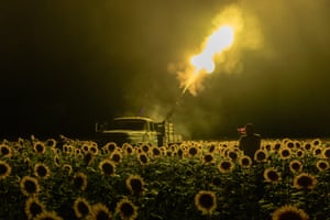 Ukrainian servicemen of the 59th brigade mobile air defence unit fire a Soviet made ZU-23 anti-aircraft twin auto-cannon towards a Russian drone from a sunflower field, during an air attack near Pavlograd