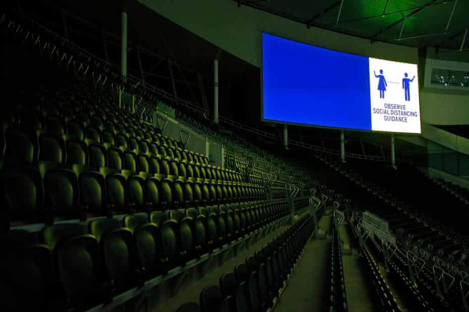 A Covid advice sign above the huge South Stand that would normally be filled with home fans during the Tottenham Hotspur v Chelsea Premier League match at the Tottenham Hotspur stadium on 4 February 2021 in London