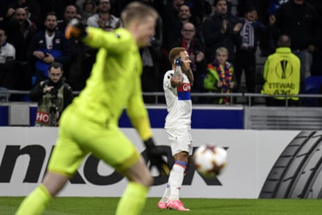 Lyon’s Memphis Depay celebrates after scoring whilst a frustrated Jordan Pickford hoikes the ball away.
