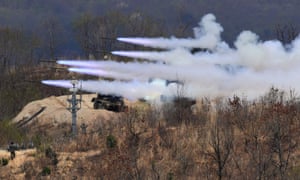 South Korea’s multiple rocket launch system fires rockets during joint live firing drill between South Korea and the US in Pocheon. The US has agreed to suspend joint war games with South Korea.