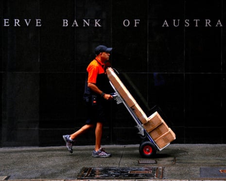 A man pushes a trolley to deliver parcels in Sydney