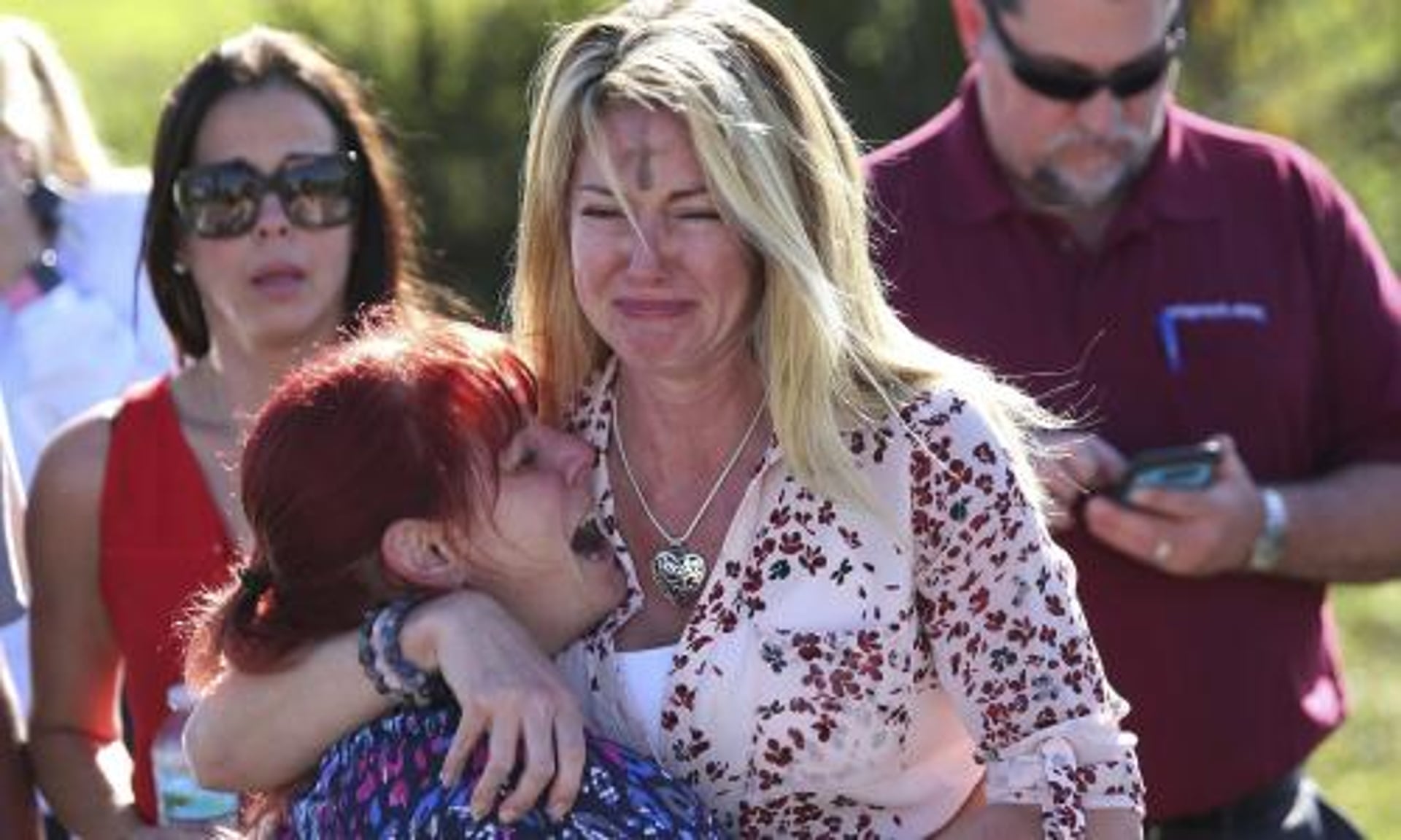 Image result for Tears in families of Florida after a gun man opened fire in campus killing more than 17