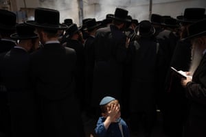 Ultra-Orthodox Jewish men and a child