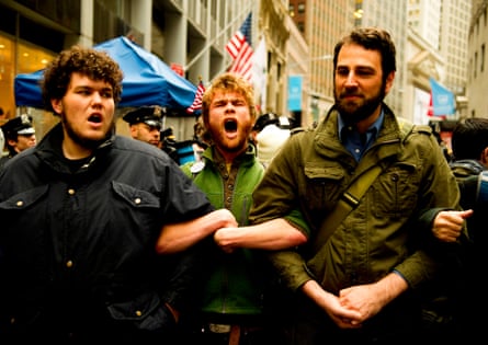people lock arms and chant outside