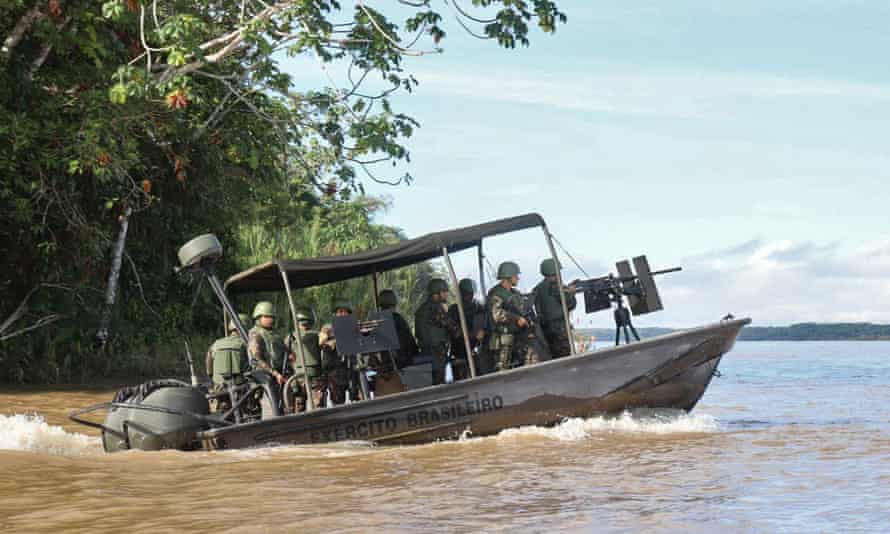 A rescue team tasked with finding the missing British missing journalist Dom Philipps and Brazilian indigenous expert Bruno Pereira at the Javari river in Acre state, Brazil, on the border with Peru.