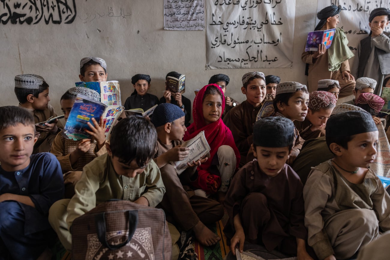 Musa Qala, Helmand. Boys and a girl are studying at a madrassa, in September 2021.