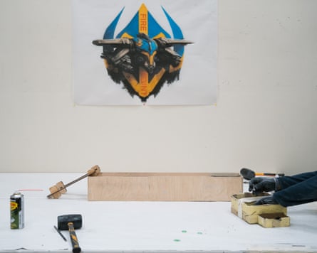 Fire Point workstation, company emblem on the wall behind.