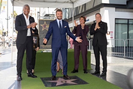 David Beckham (centre) poses next to his Hollywood Walk of Fame star alongside actor Tom Cruise (second from the right) during a ceremony in Los Angeles in June 2026.