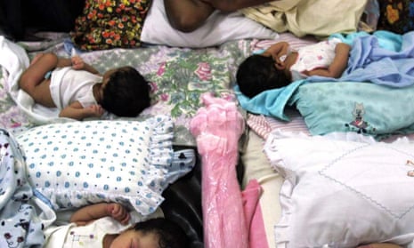 Newborn babies in Sri Lanka share a bed at a crowded central hospital in Galle, south of Colombo