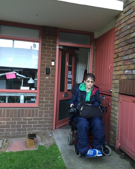 Alex outside their new accessible flat