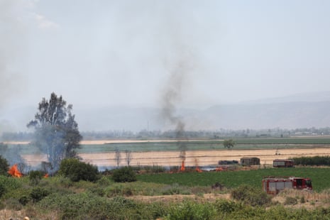 Emergency services at the scene of a fire after strikes from Lebanon, in the area of Kfar Sold in the upper Galilee, northern Israel, on Friday.