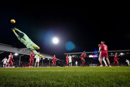 Harrison Reed (right) watches as his long-range shot flies past Alisson Becker.