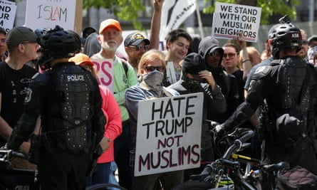 Counter-protesters hold signs outside of an ‘anti-sharia rally’ in Seattle.
