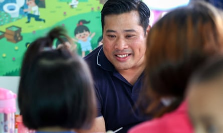 Vacharaesorn Vivacharawongse speaks to children at a childcare facility