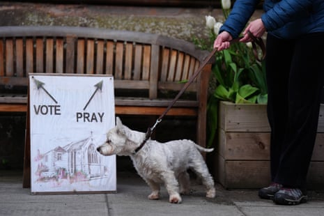 A sign outside a polling station at St James Church hall in Inverleith, Edinburgh. You are, of course, allowed to vote and pray.