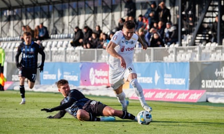 Vladyslav Veleten of Kolos Kovalivka is tackled by Emil Mustafayev of Chornomorets Odesa.