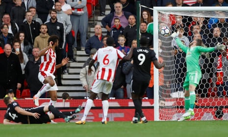 Eric Maxim Choupo-Moting scores Stoke’s second goal as they hold Manchester United to a 2-2 draw.