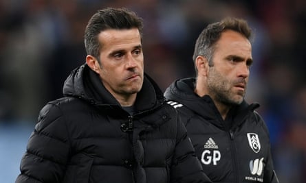 Fulham manager Marco Silva (left) walks off the pitch after losing at Aston Villa