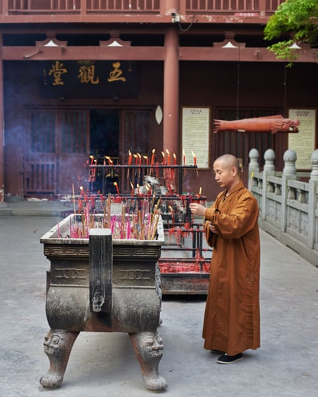 A monk at the nearby Yingtian Temple, a site of Buddhist devotion dating back to the Song Dynasty (960-1279). Since it was founded a thousand years ago the temple have been ravaged by fire numerous times, and was most recently destroyed in its entirety during the Cultural Revolution, China