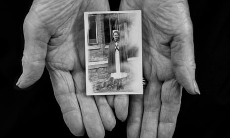 Evelyn Lamb holds a picture of herself taken in her early years as an NHS nurse. 