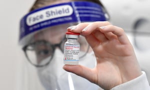 A pharmacist holds a vial of the Moderna Covid-19 in Canberra.