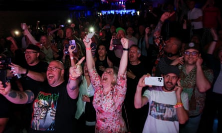 People cheering in a club