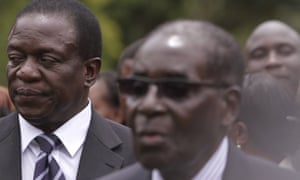 Emmerson Mnangagwa, left, stands behind Robert Mugabe in a 2014 swearing-in ceremony.