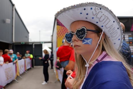 A young Scottish fan with hat and sunglasses waits for the teams to come out before the Group B match with Wales.