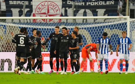Bayer Leverkusen's Patrik Schick (centre left) celebrates scoring their third goal with teammates.