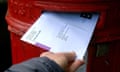 A postal vote is pushed through a letterbox