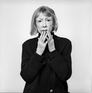 Joan Didion brings her fingers to her mouth