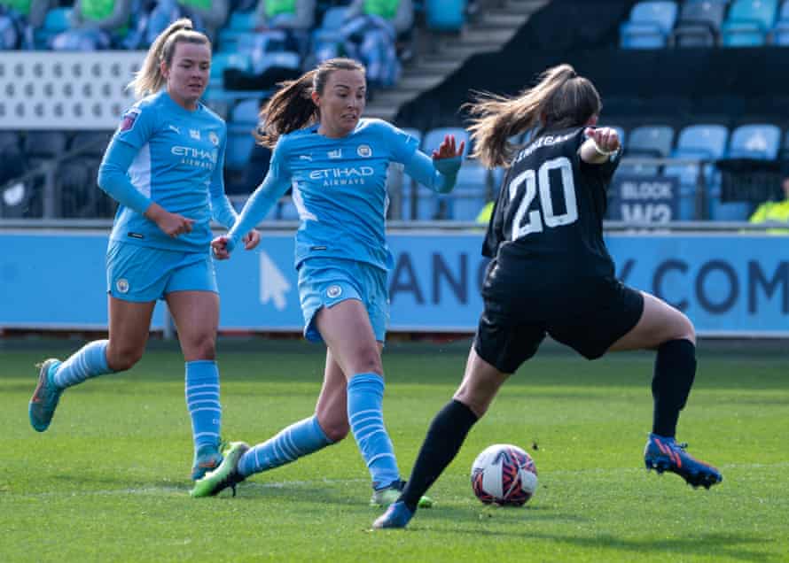 Manchester City's Caroline Weir (center) scores their third goal of the game.