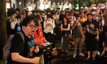 People protest outside the parliament in Taipei.